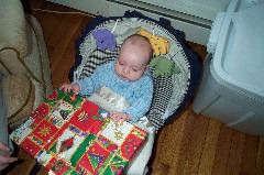 Jackson opens his first Christmas present